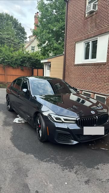 Black BMW 5 Series sedan after a detail