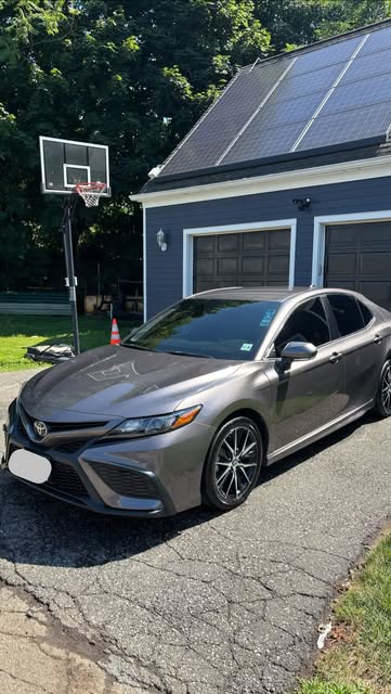 Grey Toyota Camry parked in a driveway after a detail